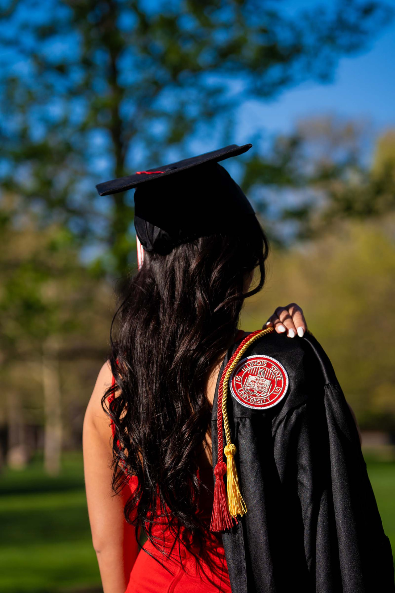 Detail of the university crest on a graduation gown