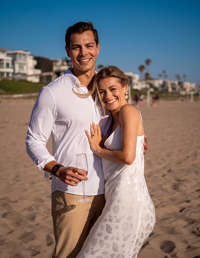 Portrait of the newly engaged couple with champagne