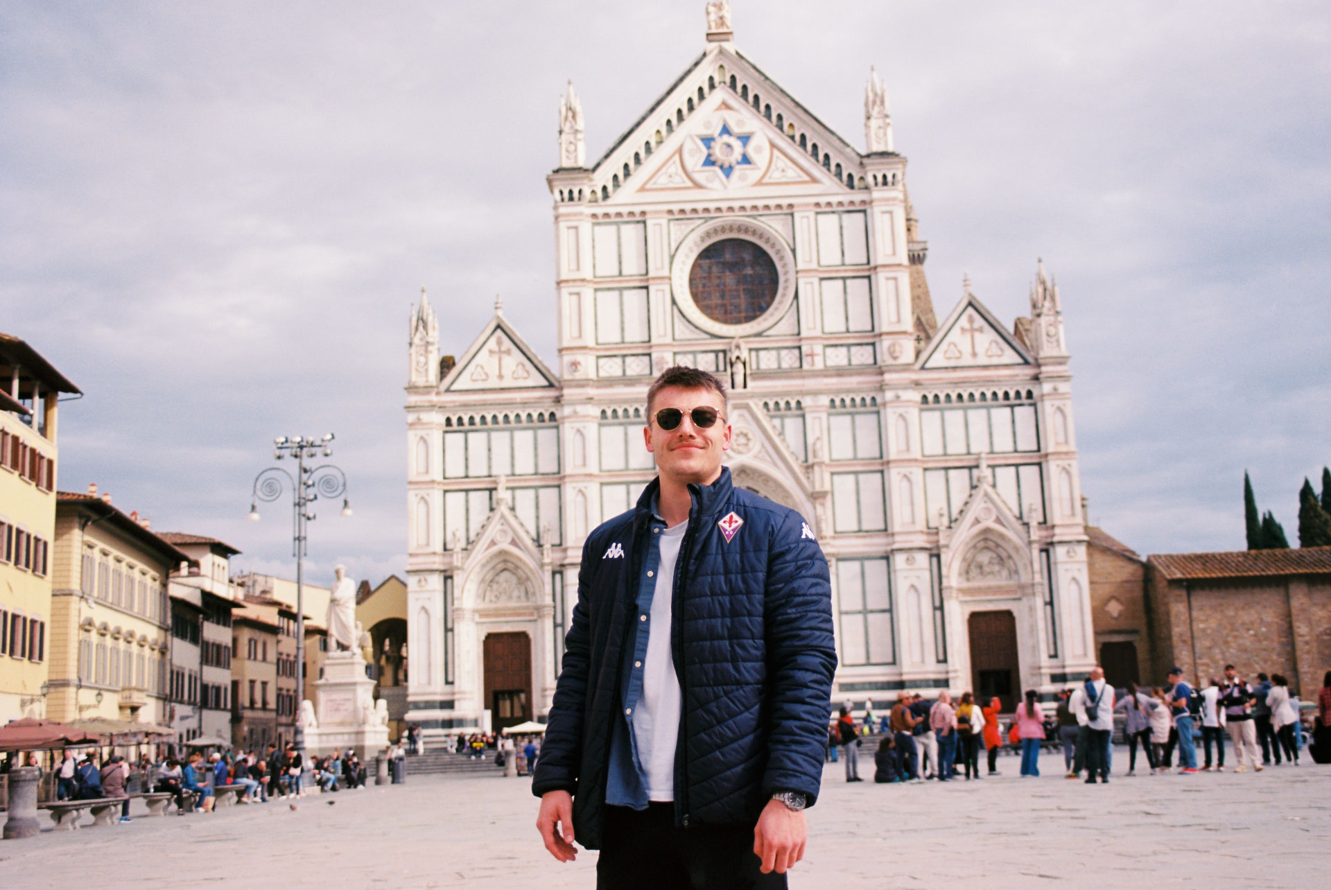 Carter Clover standing in a city square while traveling